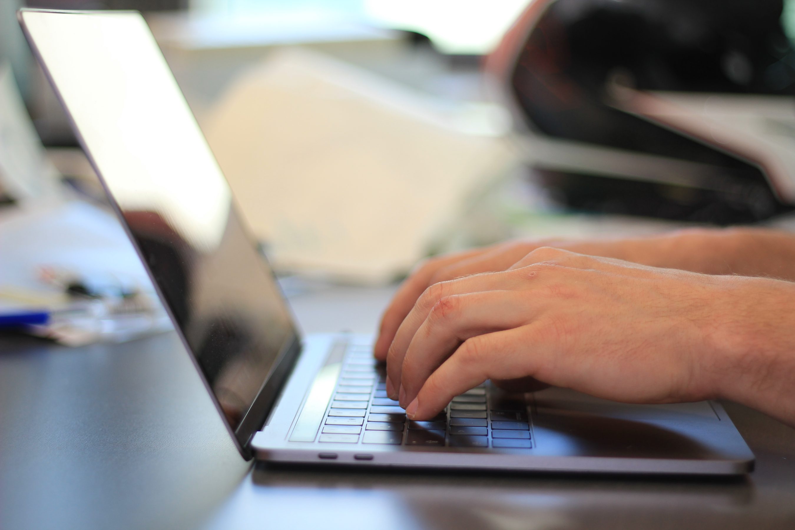 laptop and hand