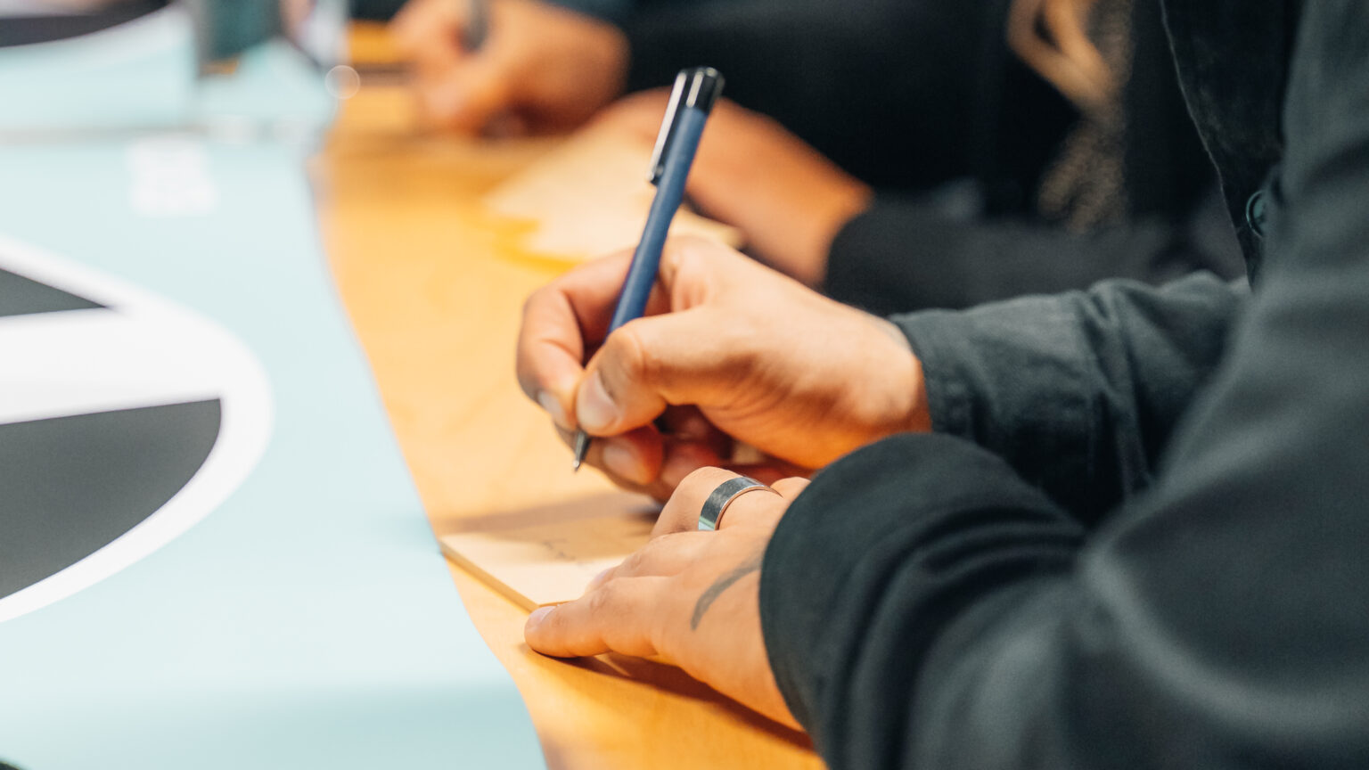 person writing a note