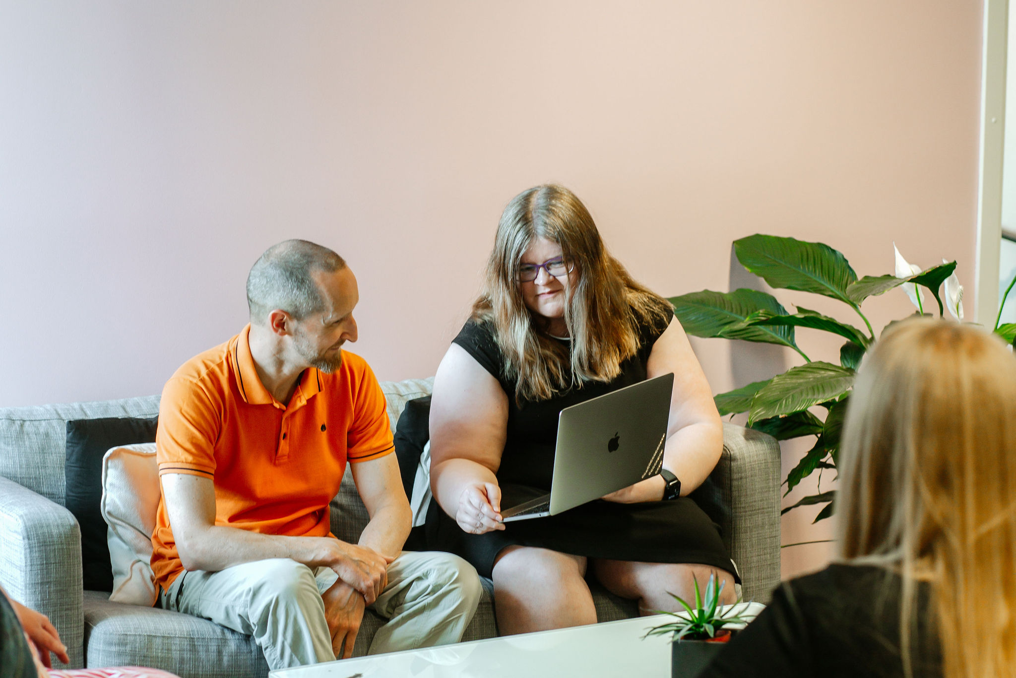Two people are working together.